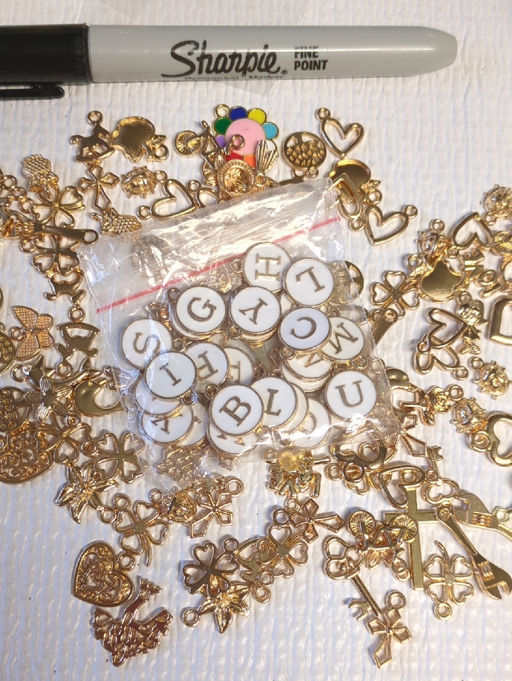 ❤️3/$10❤️Y39  Gold Charm Mix and Enamel white letters and the rest of my table